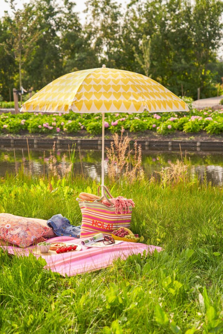 Yellow Beach Parasol with a Heart Print at a Picnic.